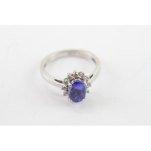 42 - 18ct white gold tanzanite diamond cluster ring (3.8g) Size L 1/2