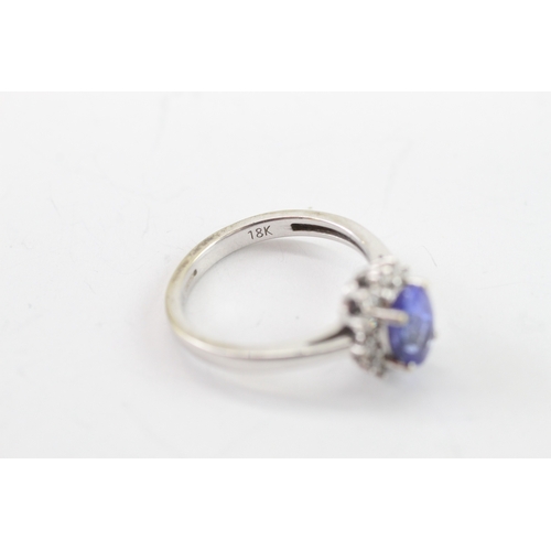 42 - 18ct white gold tanzanite diamond cluster ring (3.8g) Size L 1/2
