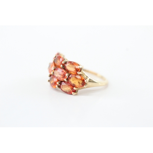 48 - 9ct gold colour enhanced orange sapphire ring (3.5g) Size K