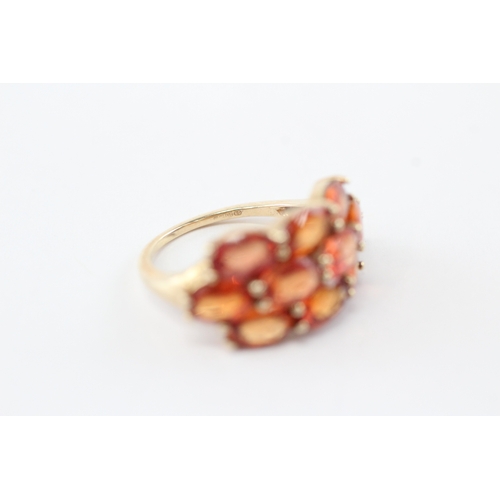 48 - 9ct gold colour enhanced orange sapphire ring (3.5g) Size K