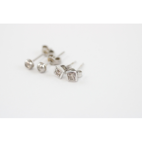 57 - 2x 9ct white gold diamond stud earrings (1.4g)