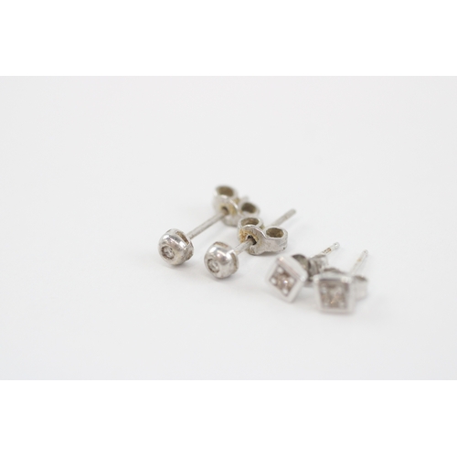 57 - 2x 9ct white gold diamond stud earrings (1.4g)