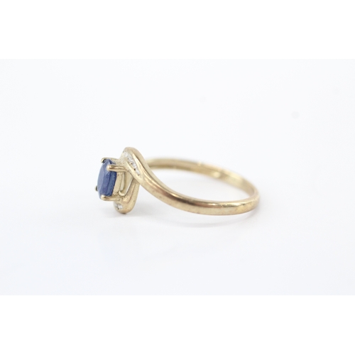 59 - 9ct gold diamond sapphire bypass ring (1.8g) Size O