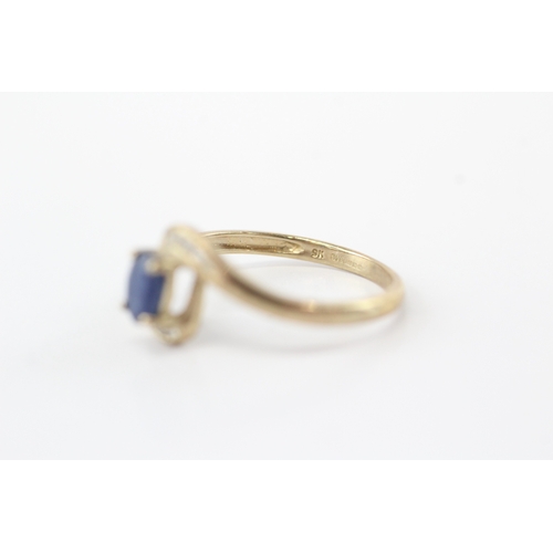 59 - 9ct gold diamond sapphire bypass ring (1.8g) Size O