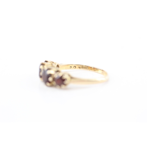 7 - 9ct gold garnet four stone ring (2.9g) Size O 1/2