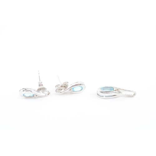 32 - 9ct white gold blue topaz earrings pendant set (2.4g)