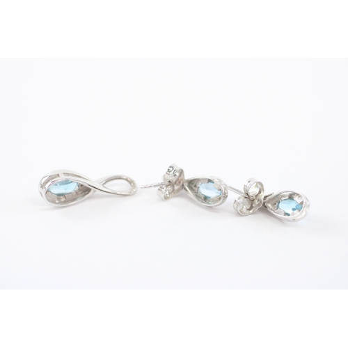 32 - 9ct white gold blue topaz earrings pendant set (2.4g)