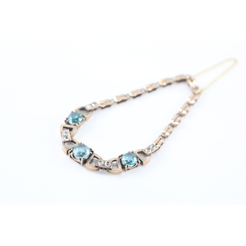 4 - 9ct gold blue zircon white paste bracelet (9g)