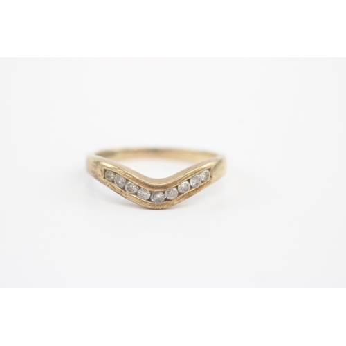 47 - 9ct gold diamond channel set wishbone ring (2.2g) Size Q