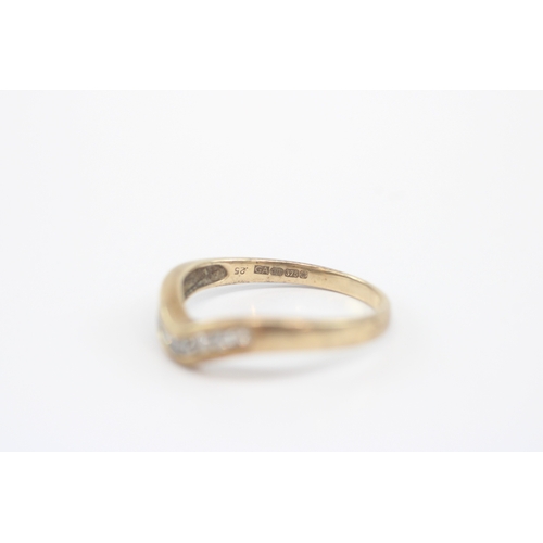 47 - 9ct gold diamond channel set wishbone ring (2.2g) Size Q