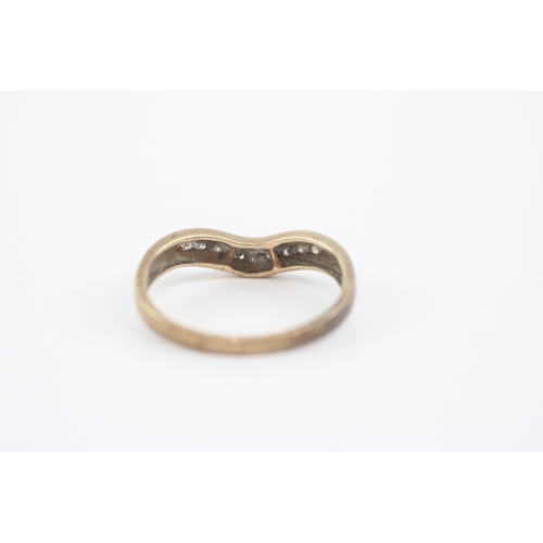 47 - 9ct gold diamond channel set wishbone ring (2.2g) Size Q