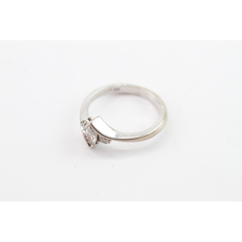53 - 18ct white gold diamond three stone ring (2.6g) Size G
