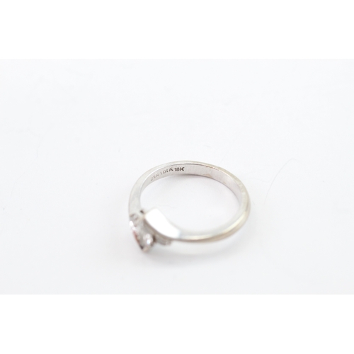 53 - 18ct white gold diamond three stone ring (2.6g) Size G