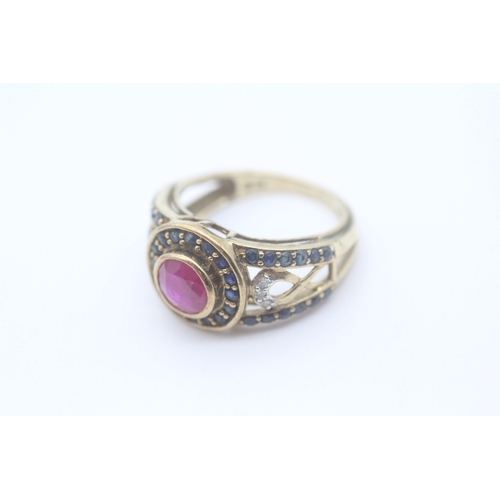 31 - 9ct gold diamond, ruby and sapphire set dress ring (3.4g) Size K