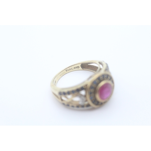 31 - 9ct gold diamond, ruby and sapphire set dress ring (3.4g) Size K