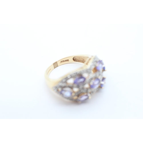 42 - 9ct gold tanzanite and diamond set dress ring (6.6g) Size Q