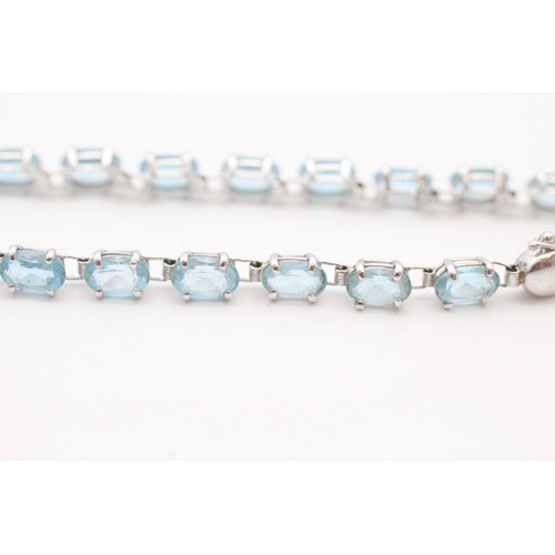 43 - 9ct white gold blue topaz set tennis bracelet (5.2g)