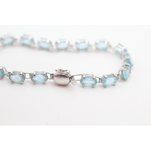 43 - 9ct white gold blue topaz set tennis bracelet (5.2g)