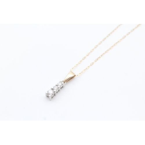 46 - 9ct gold diamond set trilogy pendant necklace (1.4g)