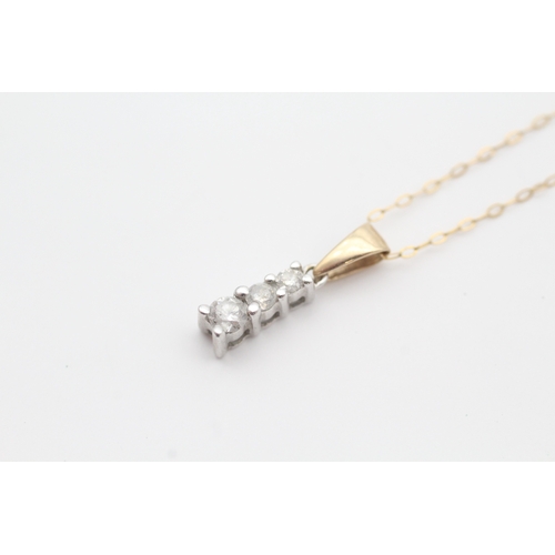 46 - 9ct gold diamond set trilogy pendant necklace (1.4g)