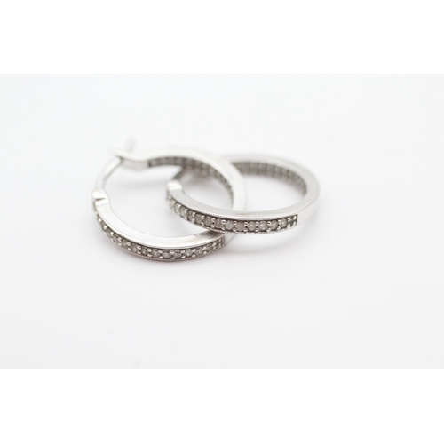 57 - 9ct white gold diamond set hoop earrings (2.6g)