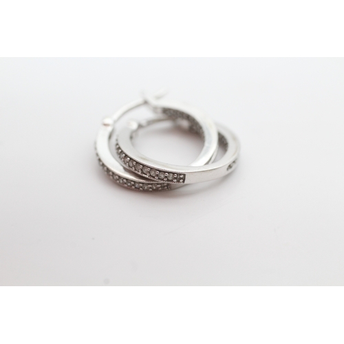 57 - 9ct white gold diamond set hoop earrings (2.6g)