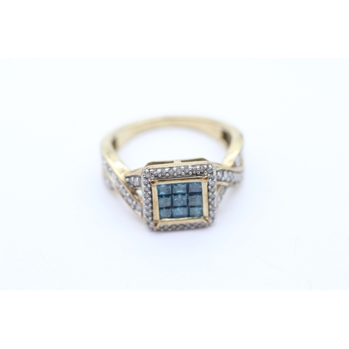 60 - 9ct gold diamond and colour enhanced blue diamond square cut twisted band ring (3.8g) Size N 1/2