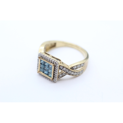 60 - 9ct gold diamond and colour enhanced blue diamond square cut twisted band ring (3.8g) Size N 1/2