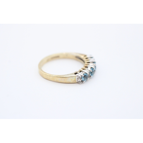 24 - 9ct gold diamond and blue topaz set eternity ring (2.8g) Size N