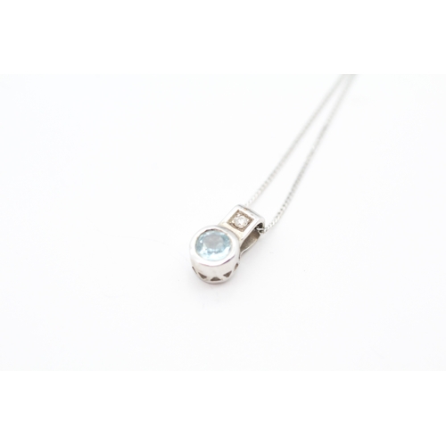 47 - 9ct white gold diamond and blue topaz pendant necklace (1.6g)