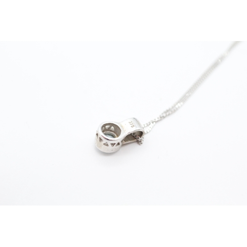 47 - 9ct white gold diamond and blue topaz pendant necklace (1.6g)