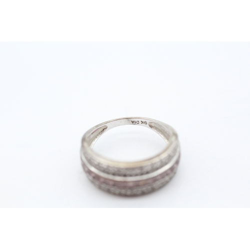 51 - 9ct white gold diamond and pink sapphire set band ring (3.9g) Size K 1/2