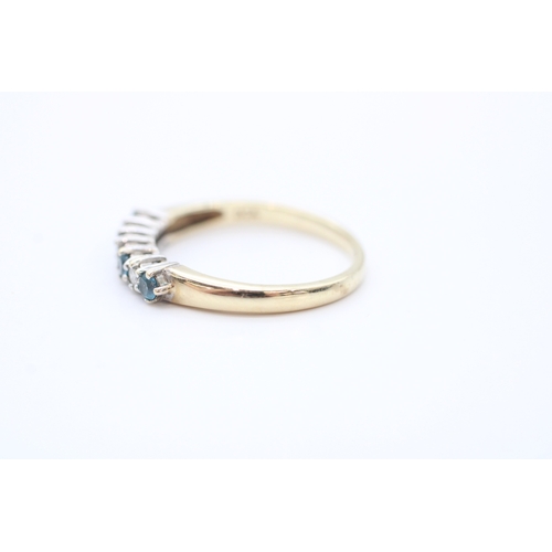 54 - 9ct gold diamond and blue topaz set eternity ring (1.8g) Size M