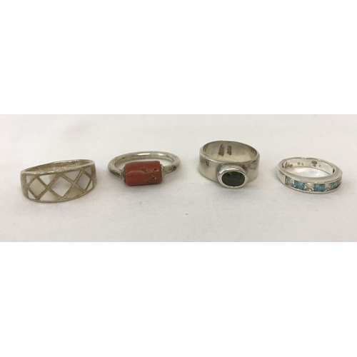 17 - 4 band style silver and white metal rings. Silver band with central bezel set oval peridot stone, ba... 