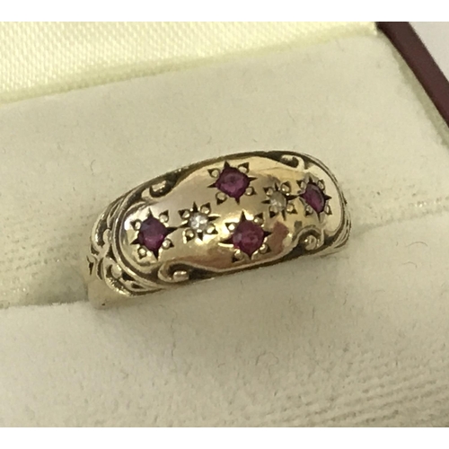 2 - An antique 9ct gold diamond and ruby set gypsy style ring. Engraved pattern to top with 4 small rubi... 