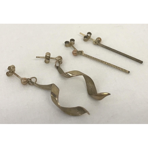 23 - 2 pairs of 9ct gold drop style earrings. A pair of bar drops together with a pair of spiral drops. T... 