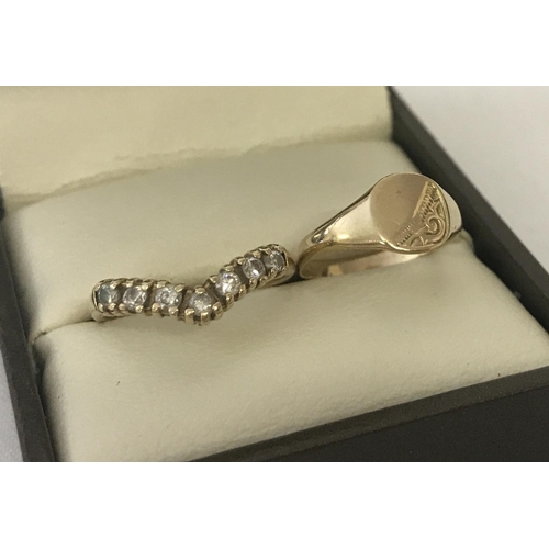 25 - 2 9ct gold children's rings. A signet ring with engraved detail to top and empty cartouche. Together... 