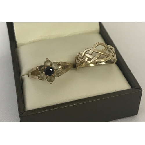 33 - 2 9ct gold scrap dress rings. A pierced Celtic design band ring. Together with a flower head design ... 