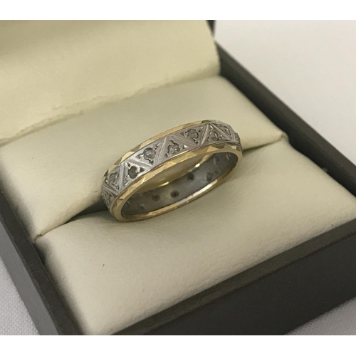 37 - An 18ct white and yellow gold full eternity ring set with small diamonds, 3 stones missing. Ring siz... 