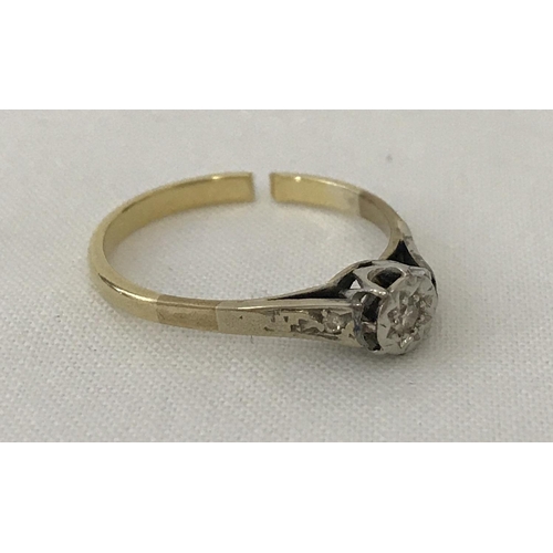41 - A vintage scrap gold illusion set diamond solitaire ring. Central diamond with a small diamond set t... 