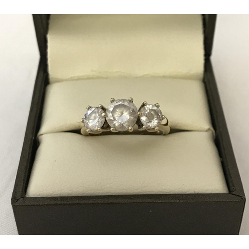 42 - A 9ct gold and clear stone set trilogy ring. Ring size P. Total weight apporx. 1.6g