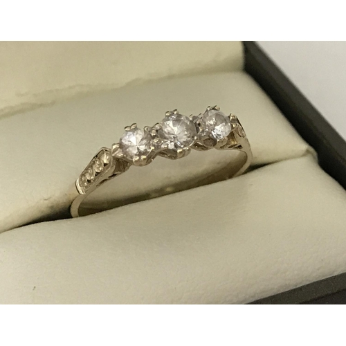 44 - A 9ct gold cubic zirconia stone set trilogy ring. Ring size L. Total weight approx. 3.5g.