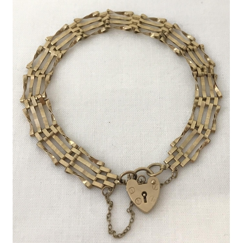 48 - A 9ct gold 4 bar bracelet with padlock clasp and safety chain. Total weight approx. 5g.