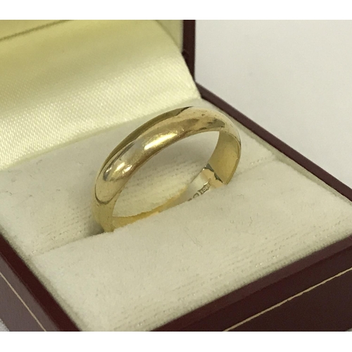 49 - An 18ct gold wedding band. Fully hallmarked to inside of band. Ring size V. Total weight approx. 5.6... 