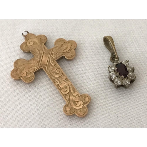 50 - A vintage gold cross pendant with engraved detail to front. Bale needs attention. Together with a sm... 