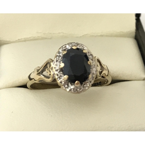 51 - A vintage 9ct gold sapphire and diamond dress ring. Central oval cut sapphire approx. 1ct, surrounde... 