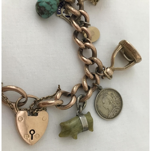 7 - A vintage 9ct chunky rose gold charm bracelet with padlock and safety chain. Together with a number ... 