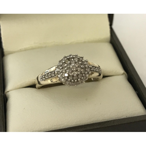 9 - A 9ct gold and diamond cluster ring. Diamonds total approx .25ct. Ring size P½. Total weight approx.... 