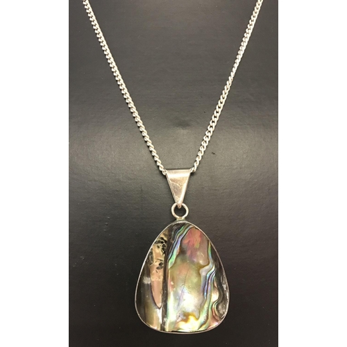 1001 - An abalone shell and silver pendant on a 24