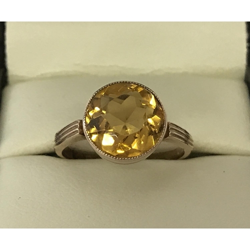 1005 - A vintage 9ct gold dress ring set with a large round cut Citrine approx. 4ct. Bezel style setting, r... 